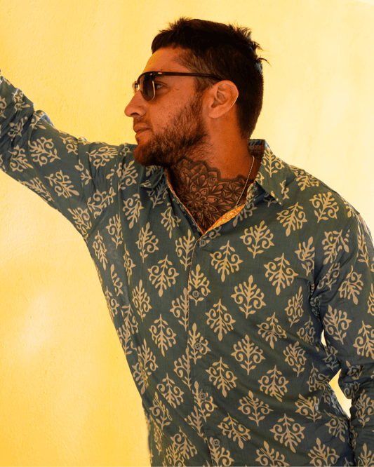 SAIRA Long Sleeve Shirt worn by a man, featuring a patterned design and sunglasses against a yellow background — The Cocoon Way