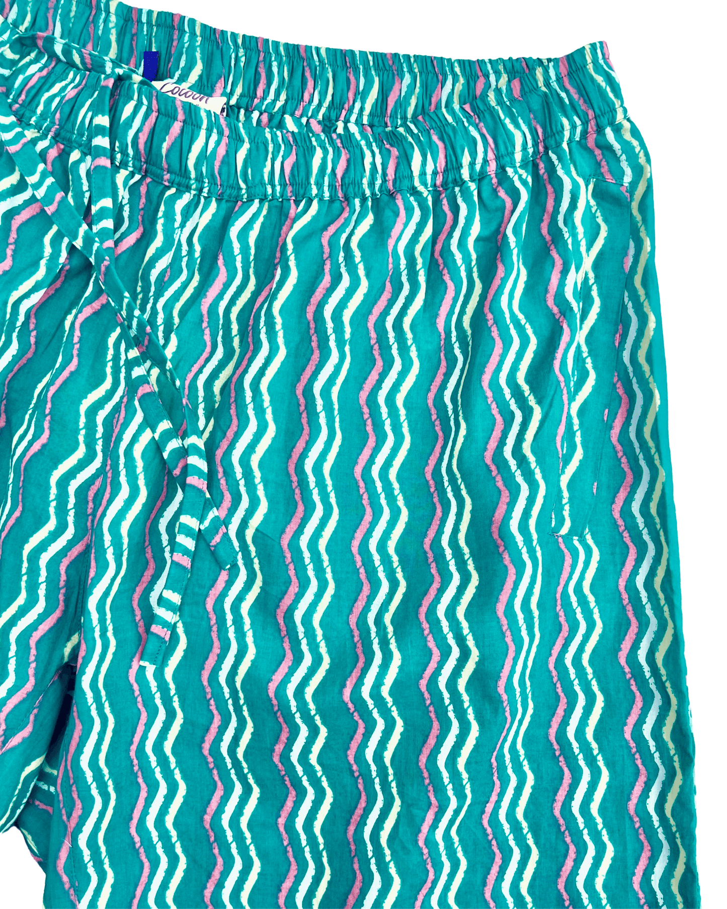 PADMA Cotton Shorts in vibrant neon wave pattern, featuring lightweight cotton and elastic waistband for comfort.