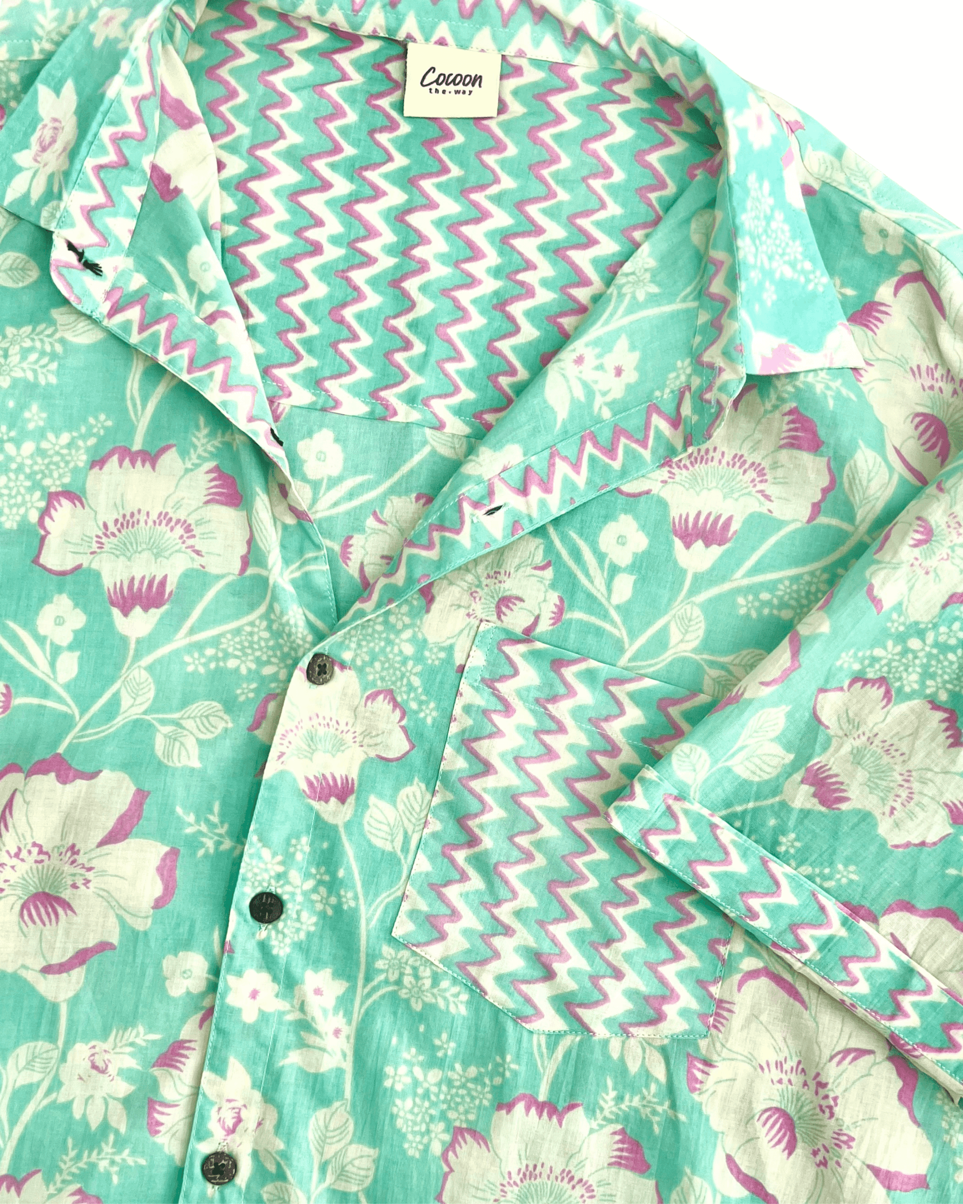PADMA Short Sleeve Shirt with floral pattern and vibrant colors, featuring lightweight Cambric cotton fabric.