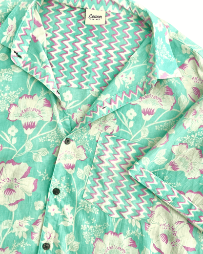 PADMA Short Sleeve Shirt with floral pattern and vibrant colors, featuring lightweight Cambric cotton fabric.