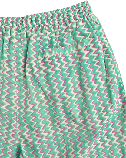 PADMA Cotton Shorts in Neon Bloom pattern featuring a colorful zigzag design and elastic waistband.