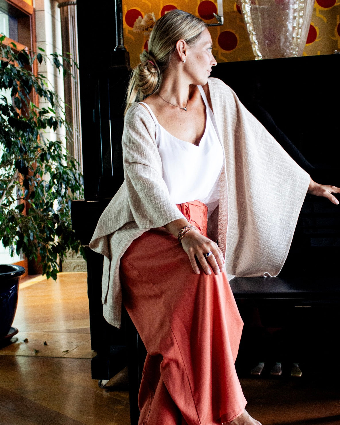 Woman wearing KOKO Bamboo-Cotton Drape over a simple outfit, showcasing relaxed elegance and lightweight fabric.