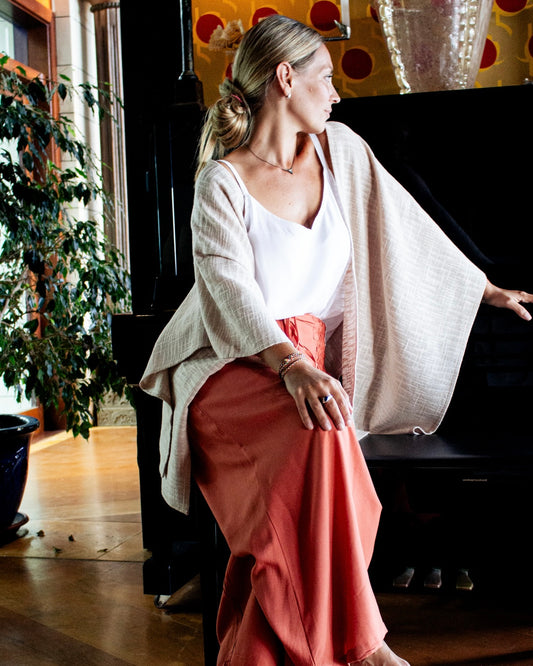 Woman wearing KOKO Bamboo-Cotton Drape over a simple outfit, showcasing relaxed elegance and lightweight fabric.