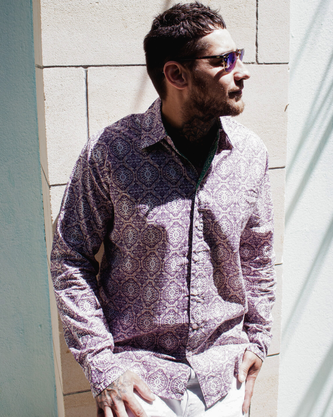 Man wearing SAIRA Long Sleeve Shirt Jaipur, featuring a stylish pattern and sunglasses, standing against a wall — The Cocoon Way