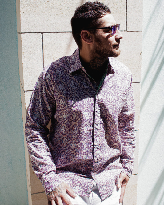 Man wearing SAIRA Long Sleeve Shirt Jaipur, featuring a stylish pattern and sunglasses, standing against a wall.