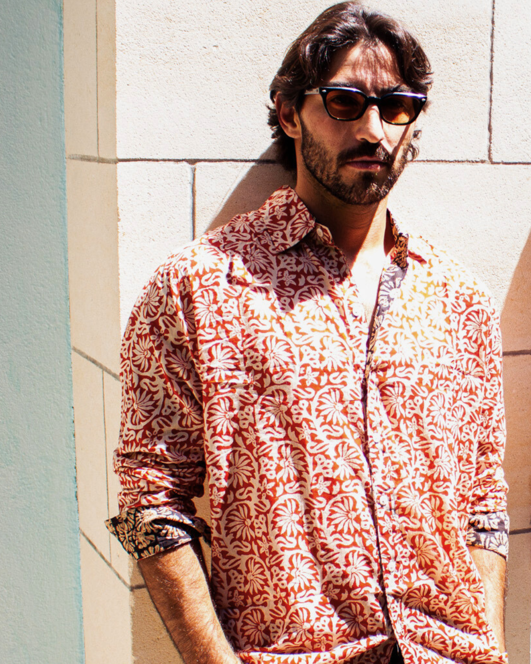 Model wearing SAIRA Long Sleeve Shirt Sevilla with a floral pattern, showcasing style and comfort in natural cotton.