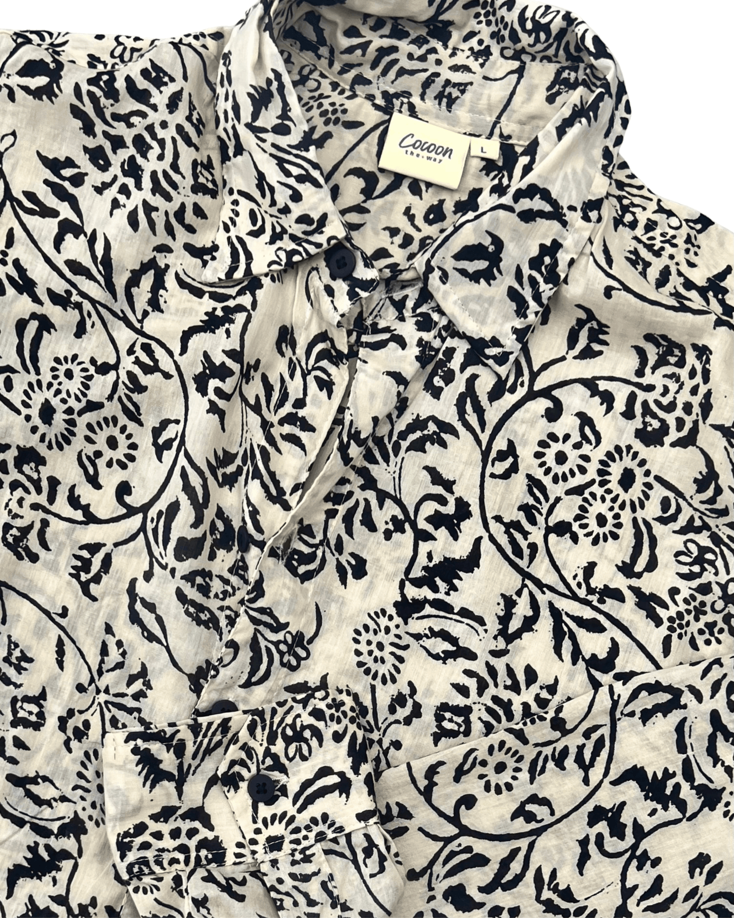 SAIRA Long Sleeve Shirt in cream with black floral pattern, showcasing stylish design and breathable cotton fabric.