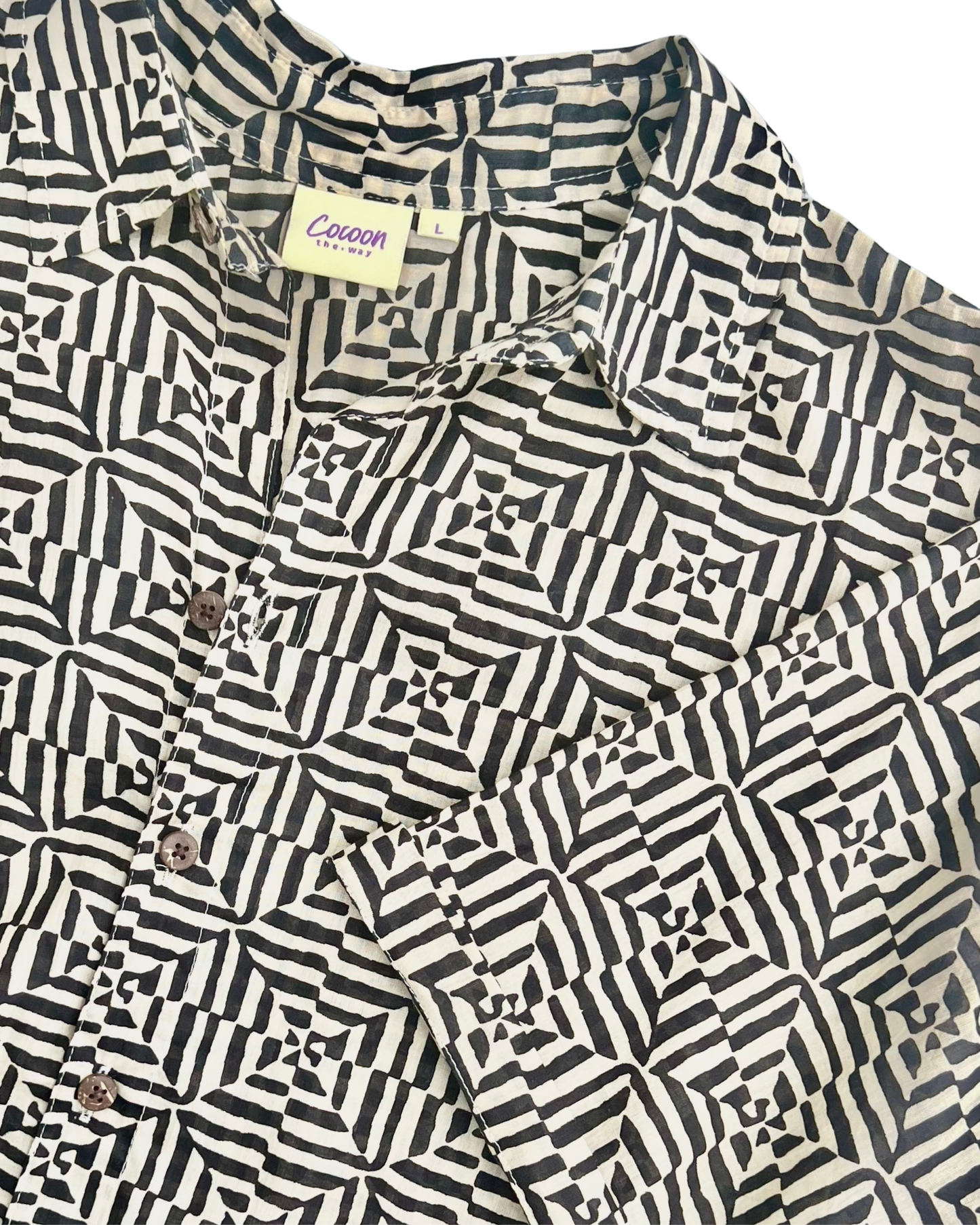 SAIRA Short Sleeve Shirt featuring a stylish black and white geometric pattern and smooth Cambric cotton fabric.