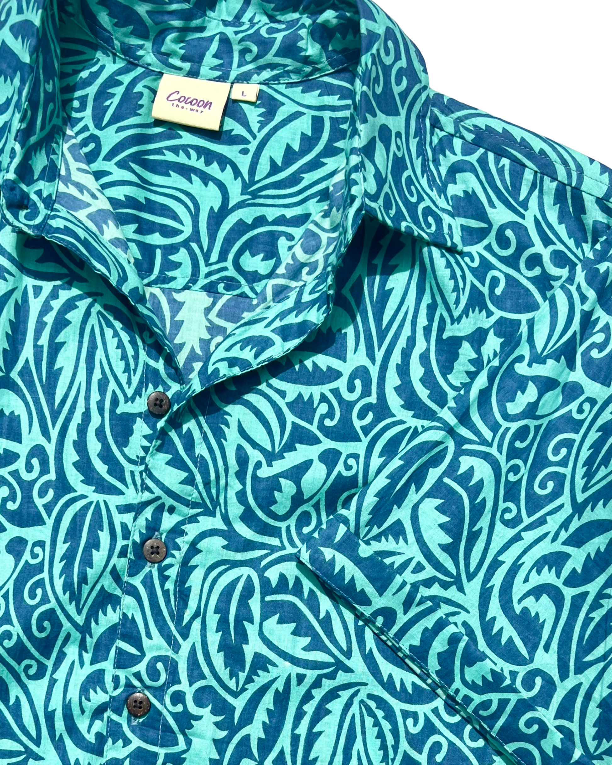 SAIRA Short Sleeve Shirt featuring vibrant blue floral pattern, made from breathable Cambric or Voile cotton.