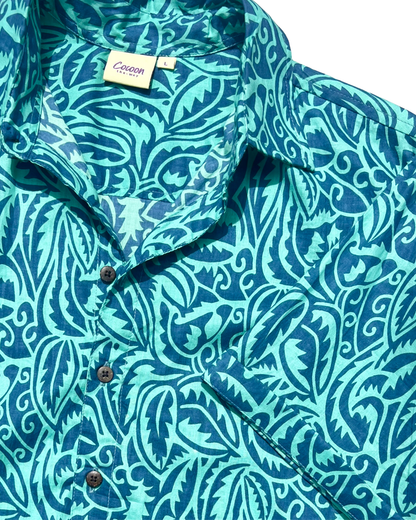 SAIRA Short Sleeve Shirt featuring vibrant blue floral pattern, made from breathable Cambric or Voile cotton.