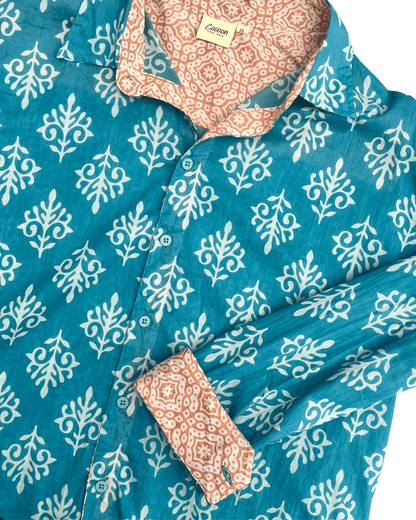 SAIRA Long Sleeve Shirt in blue with white floral pattern and contrasting orange patterned collar — The Cocoon Way