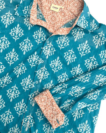SAIRA Long Sleeve Shirt in blue with white floral pattern and contrasting orange patterned collar.