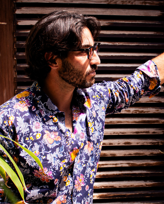 PADMA Long Sleeve Shirt Amsterdam worn by a man in a floral print during an outdoor setting.