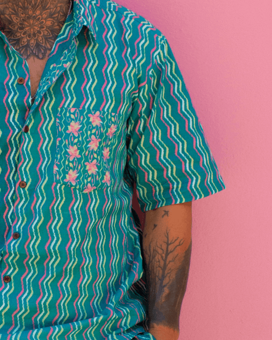 PADMA Short Sleeve Shirt Neon Wave featuring vibrant patterns against a pink background — The Cocoon Way