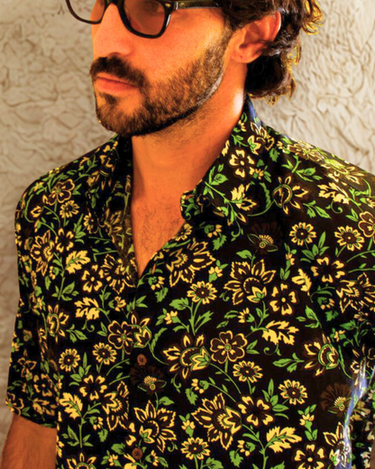 Model wearing PADMA Short Sleeve Shirt in Night Flower print, showcasing elegant floral design and breathable fabric.