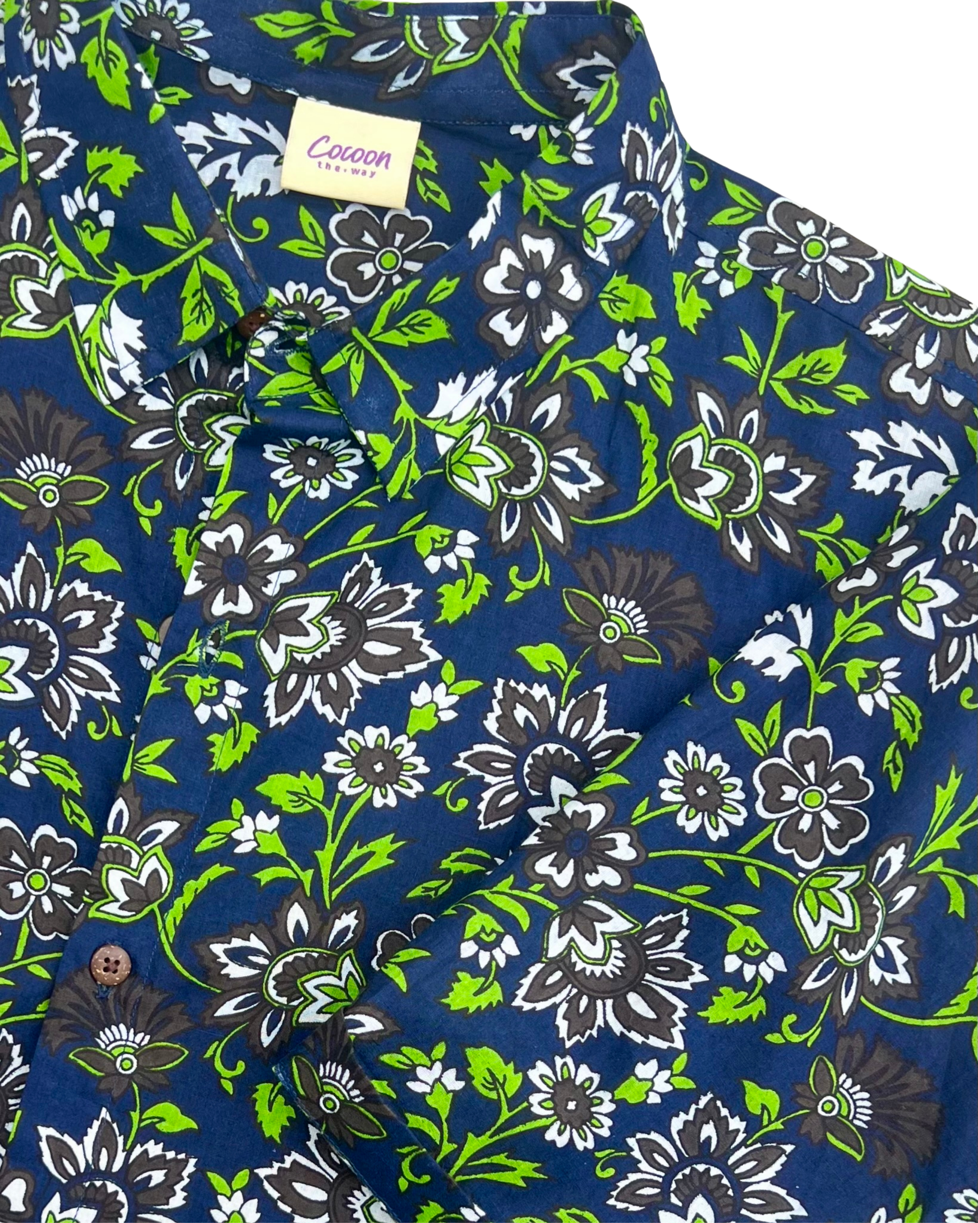 PADMA Short Sleeve Shirt featuring a vibrant night flower pattern in blue, green, and black hues — The Cocoon Way